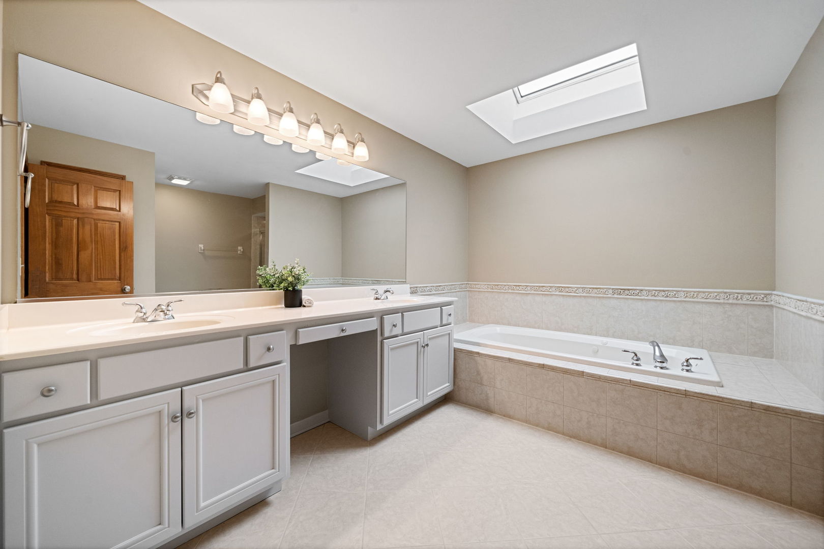 4123 Easy Circle Naperville, IL 60564 - Photo 27 of 45 a spacious bathroom with a double vanity sink mirror and bathtub