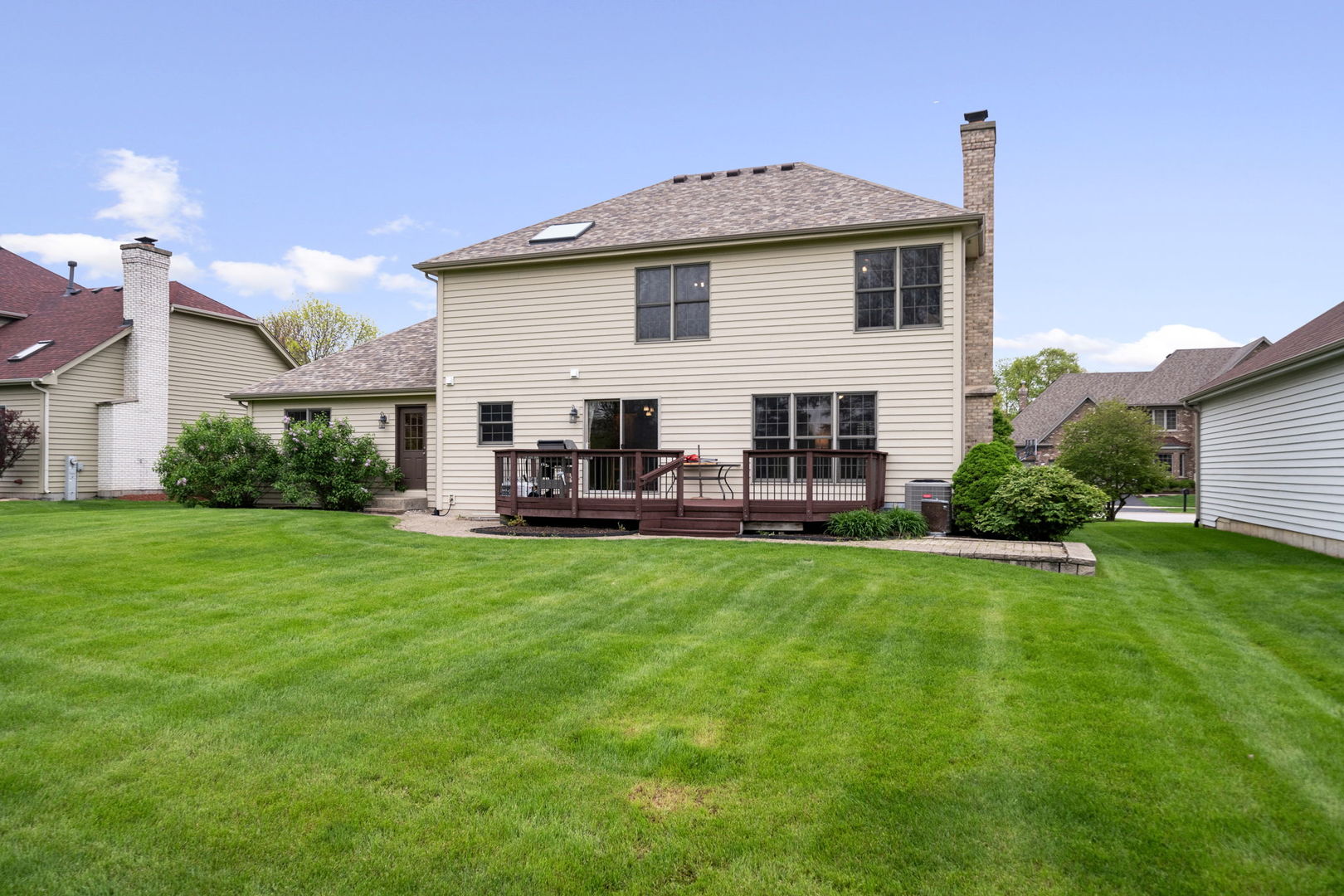 4123 Easy Circle Naperville, IL 60564 - Photo 41 of 45 a front view of a house with patio and garden