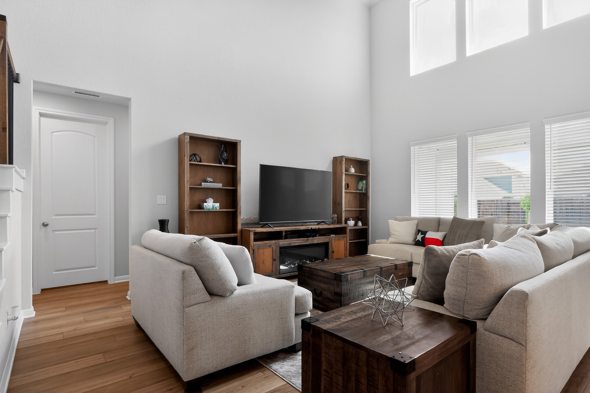114 Bosco Road Hutto, TX 78634 - Photo 32 of 39 A grand living space with soaring ceilings and abundant natural light invites comfortable gatherings.