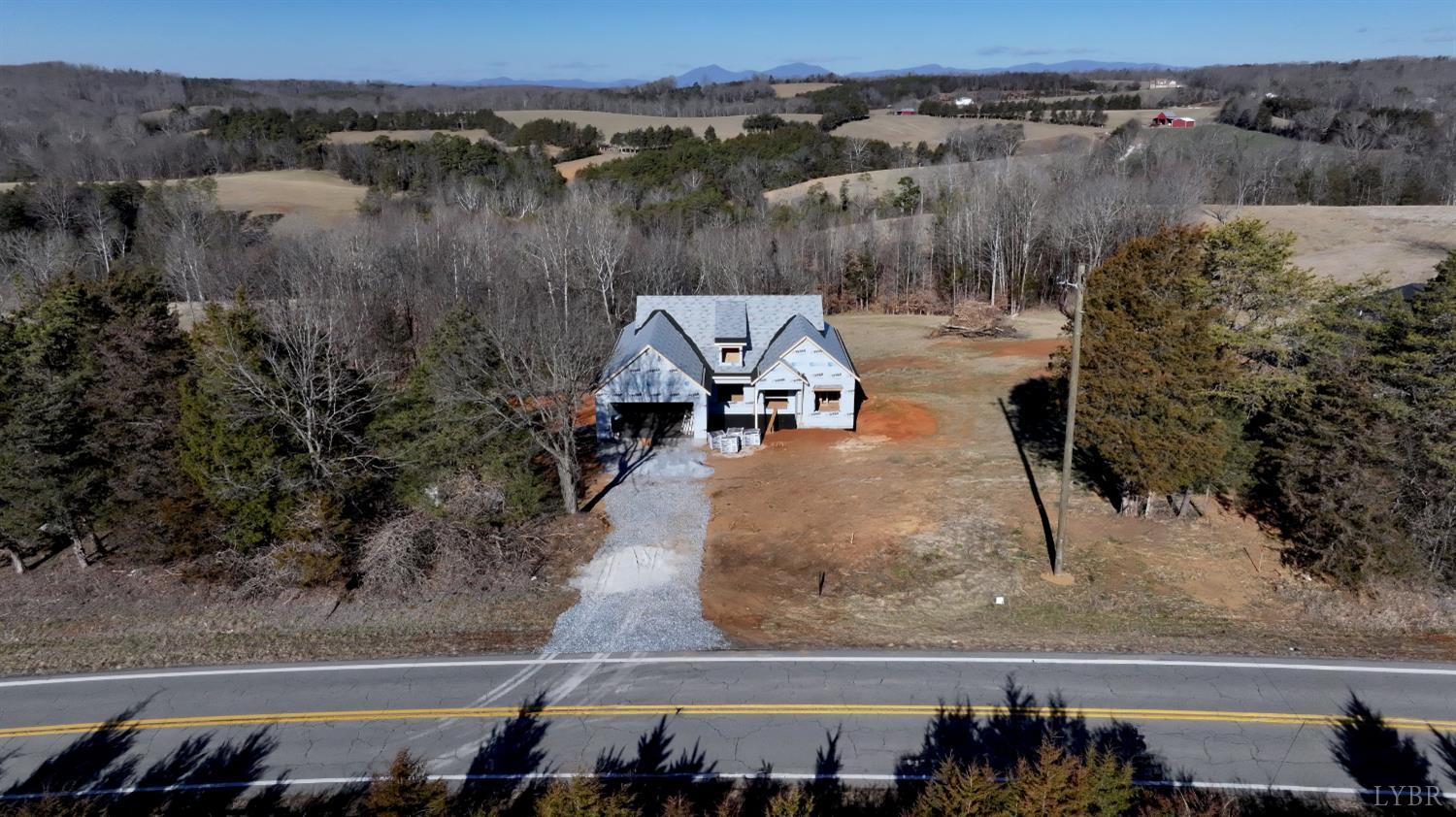 6 Leesville Road Evington, VA 24550 - Photo 11 of 44 a view of a terrace with a garden and bench