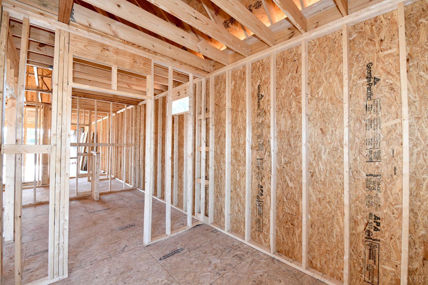 6 Leesville Road Evington, VA 24550 - Photo 37 of 44 a view of an empty room with wooden floor and a window