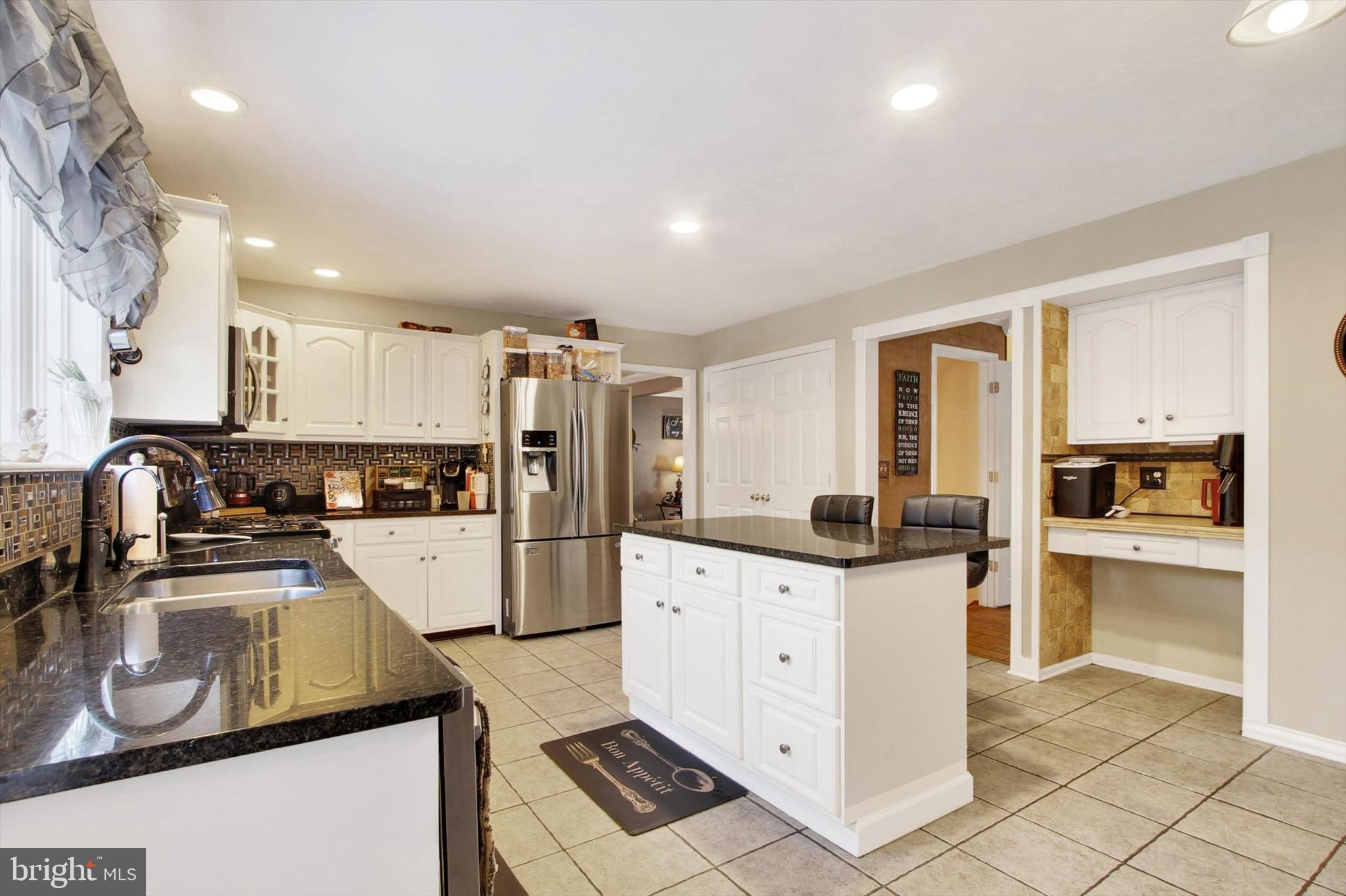 1122 Laurel Drive York, PA 17404 - Photo 14 of 38 a kitchen with granite countertop a sink stove and refrigerator