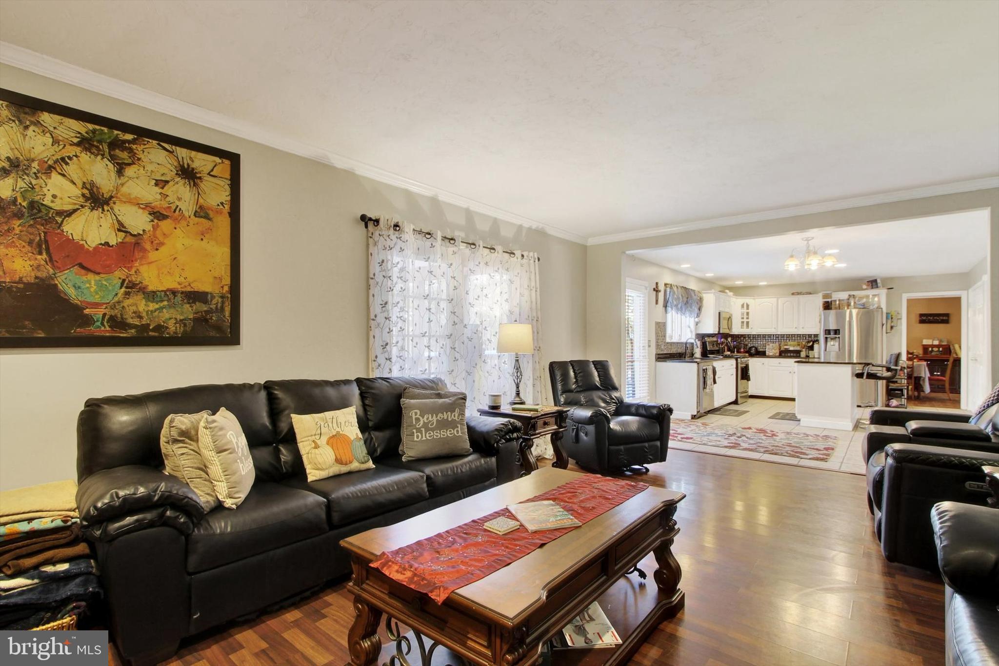 1122 Laurel Drive York, PA 17404 - Photo 19 of 38 a living room with furniture a rug and a flat screen tv