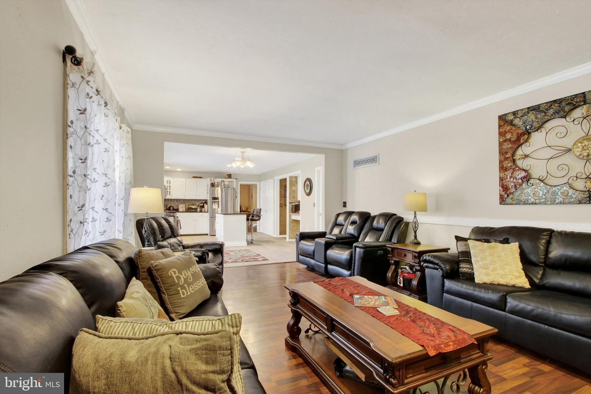 1122 Laurel Drive York, PA 17404 - Photo 20 of 38 a living room with furniture a wooden floor and next to a window