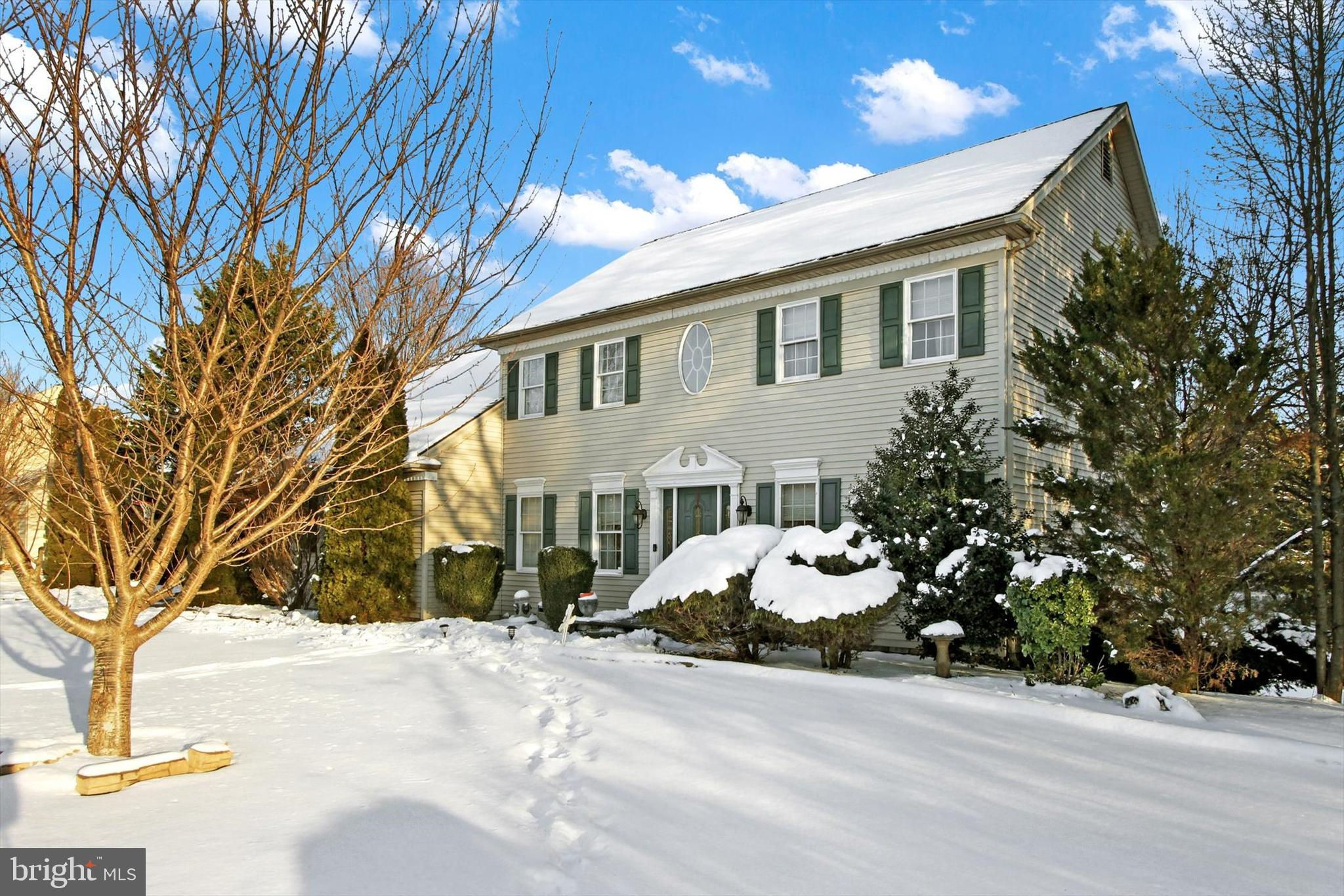 1122 Laurel Drive York, PA 17404 - Photo 2 of 38 a front view of a house with a yard and garage