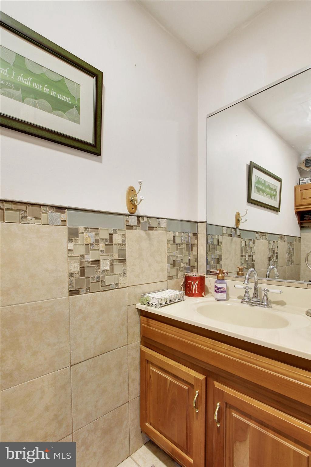 1122 Laurel Drive York, PA 17404 - Photo 23 of 38 a bathroom with a sink and a mirror