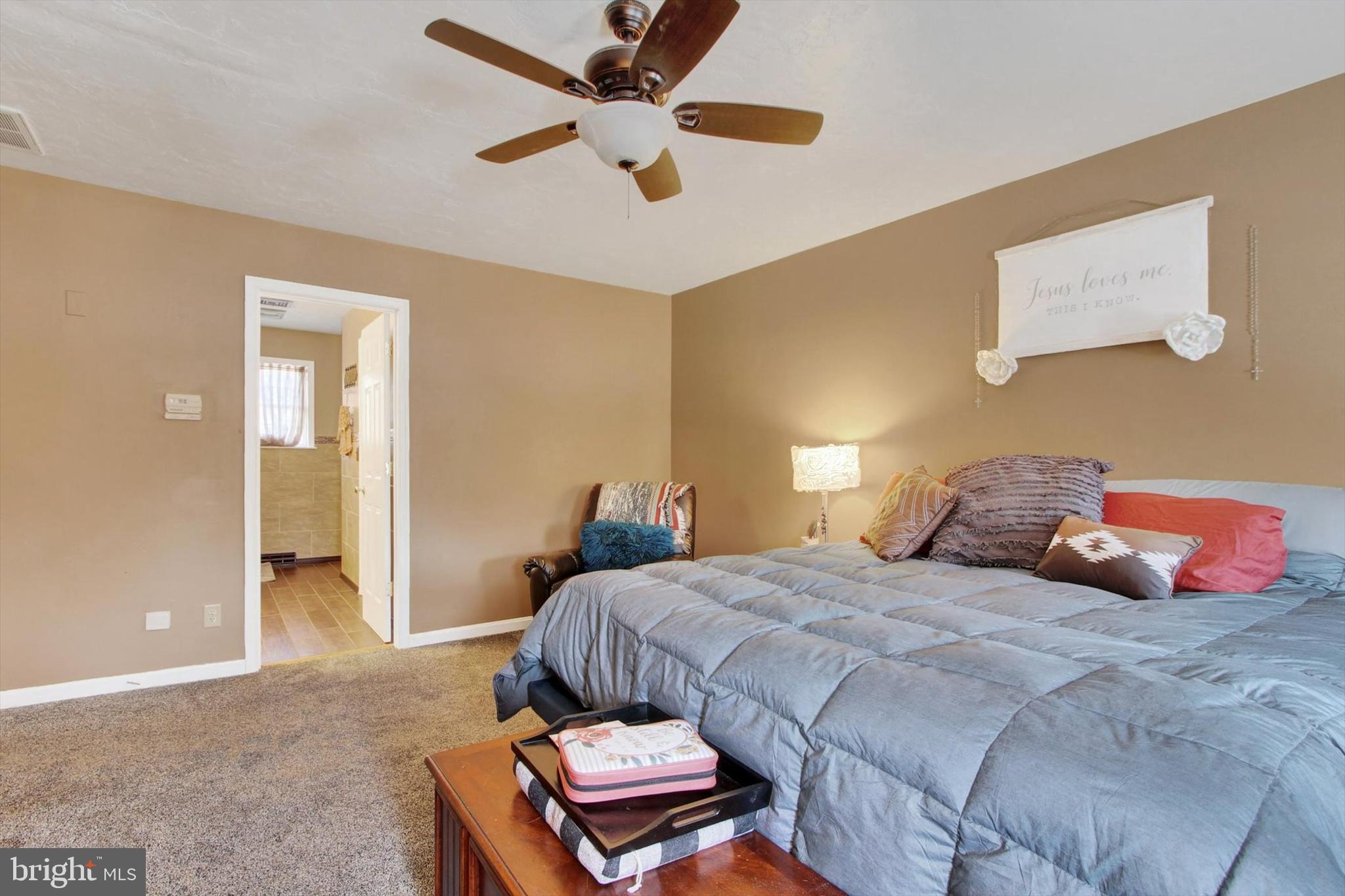 1122 Laurel Drive York, PA 17404 - Photo 25 of 38 a bedroom with a bed and a chandelier