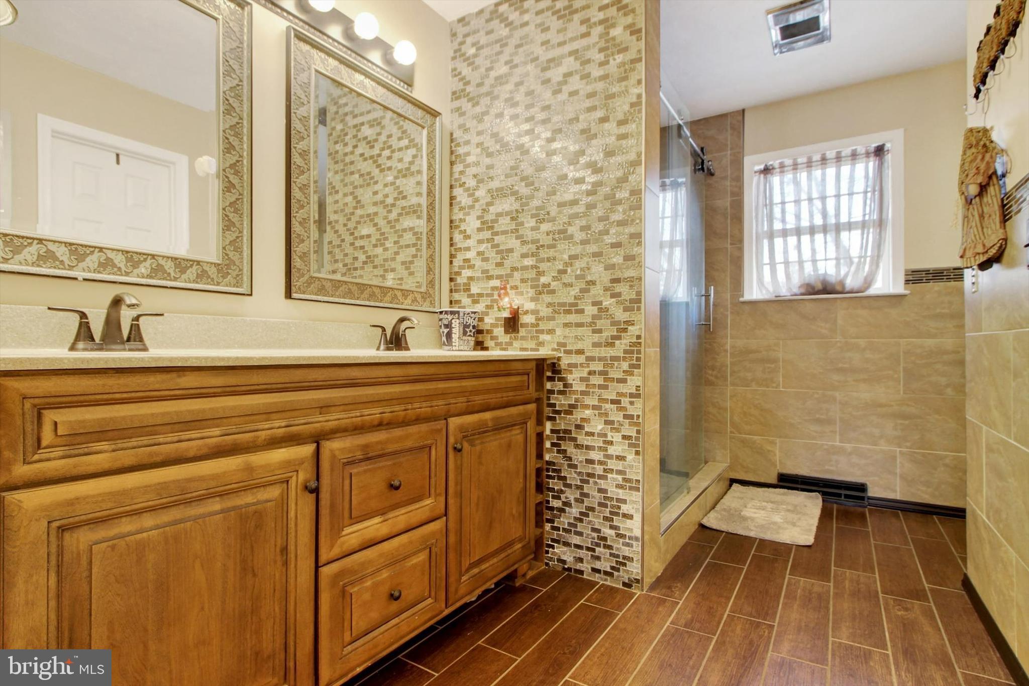 1122 Laurel Drive York, PA 17404 - Photo 26 of 38 a bathroom with a sink and a mirror