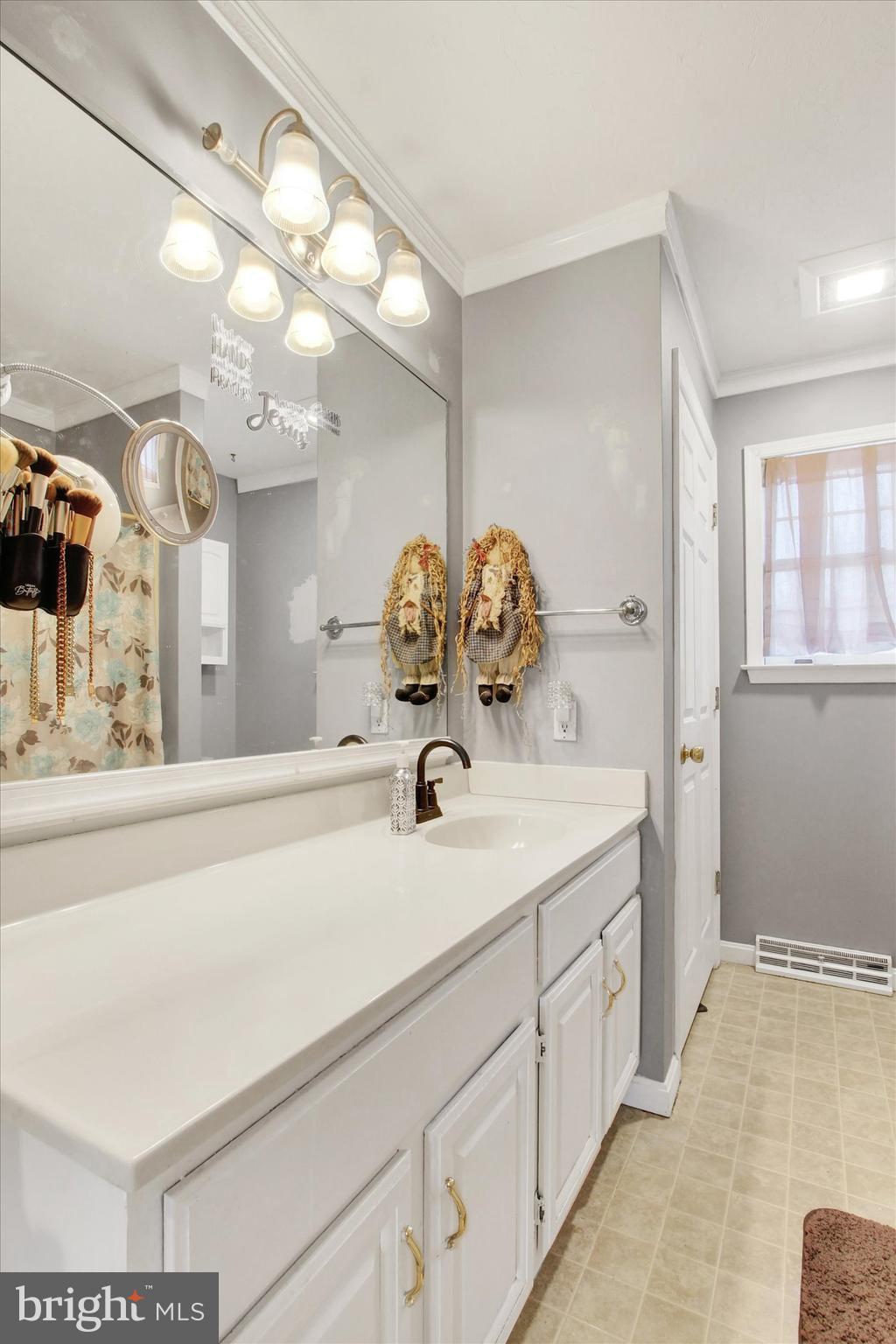 1122 Laurel Drive York, PA 17404 - Photo 30 of 38 a bathroom with a sink and a mirror