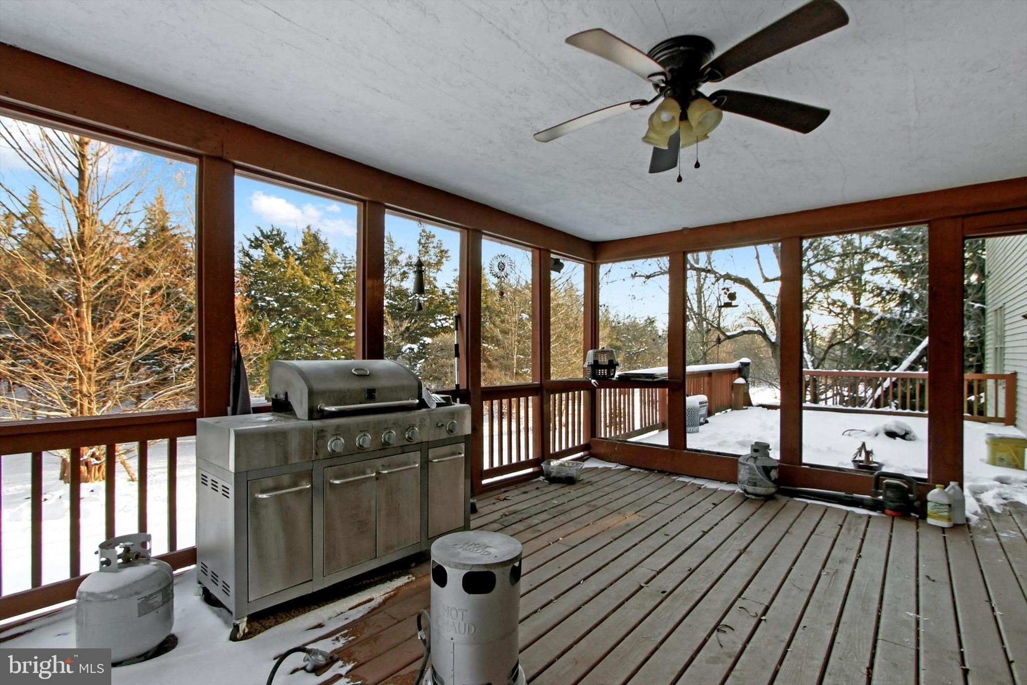 1122 Laurel Drive York, PA 17404 - Photo 35 of 38 a kitchen with stainless steel appliances wooden floors stove and a large window