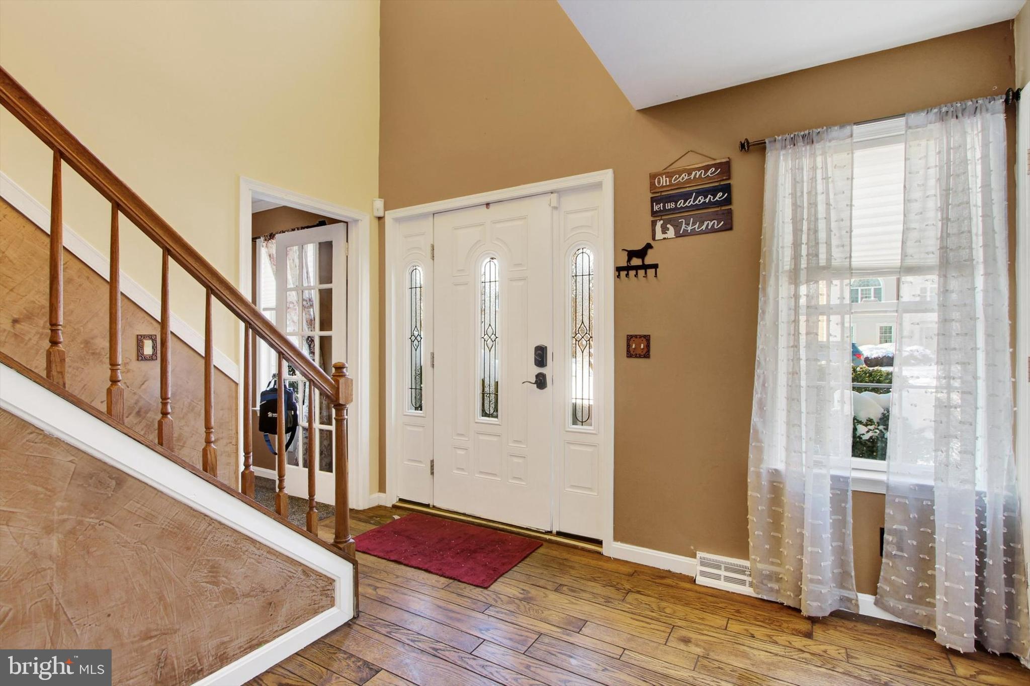 1122 Laurel Drive York, PA 17404 - Photo 4 of 38 a view of an entryway with wooden floor and windows