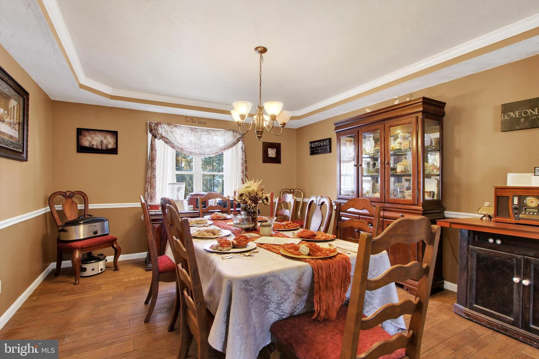 1122 Laurel Drive York, PA 17404 - Photo 10 of 38 a view of a dining room with furniture and chandelier