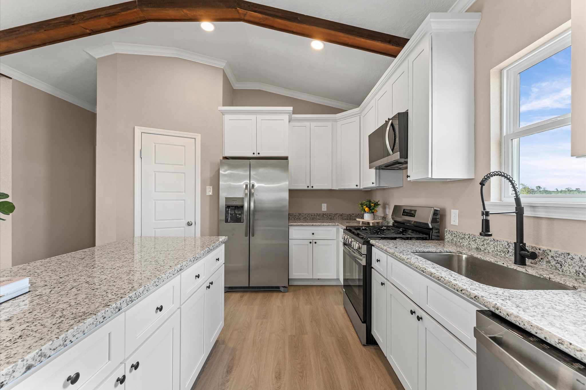 1207 Peter Pne Street Huffman, TX 77336 - Photo 13 of 30 a kitchen with refrigerator cabinets and a sink