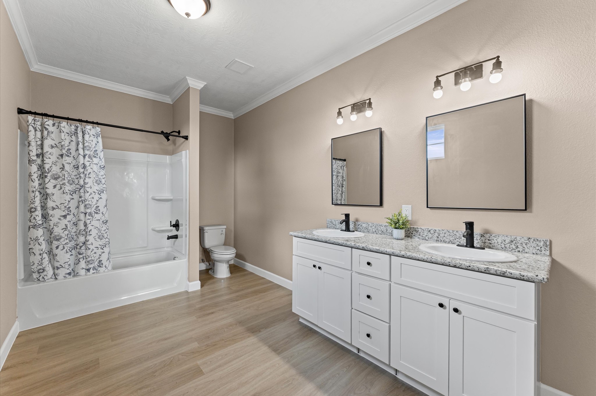 1207 Peter Pne Street Huffman, TX 77336 - Photo 19 of 30 a bathroom with a double vanity sink and mirror with shower
