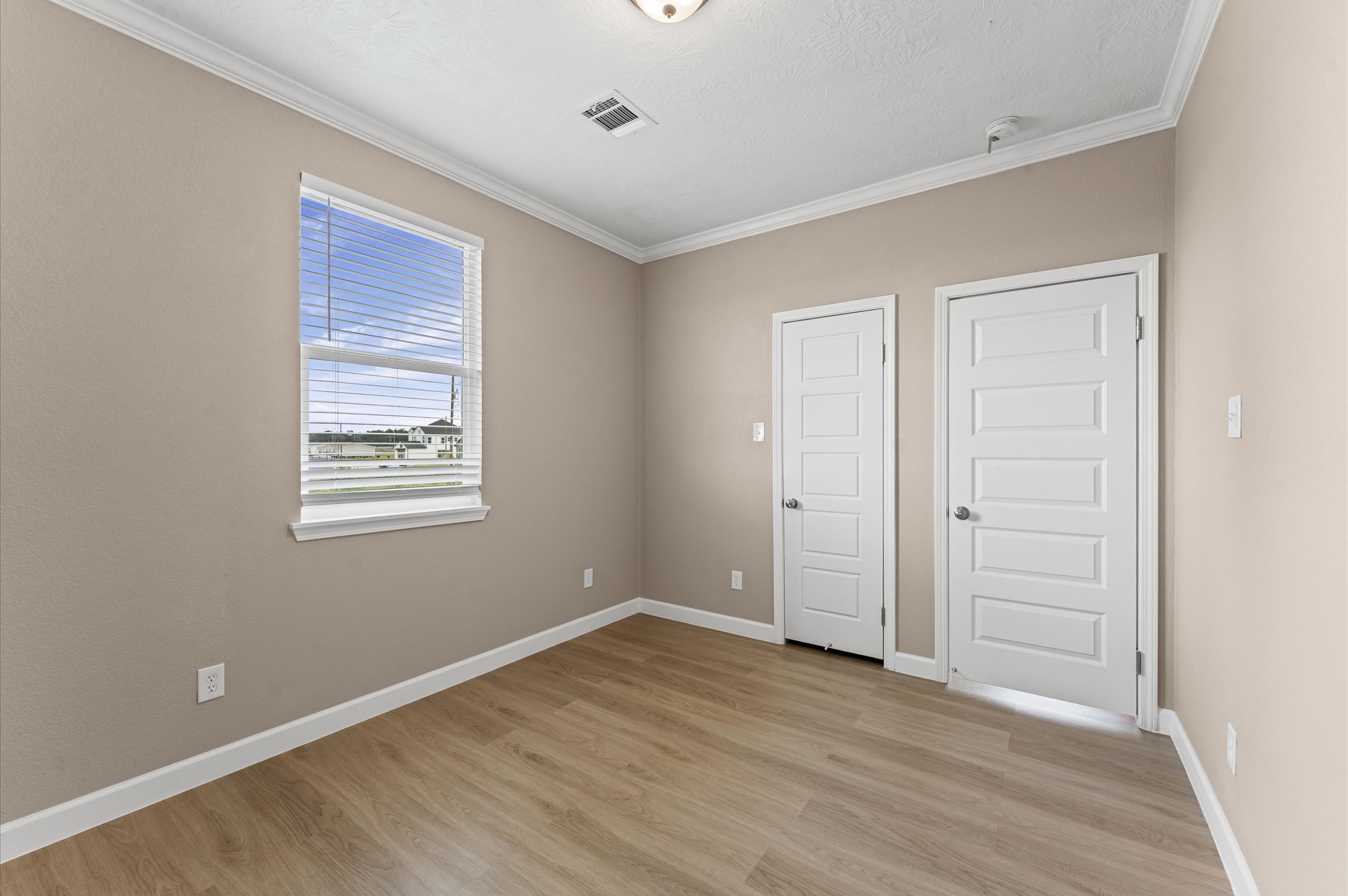 1207 Peter Pne Street Huffman, TX 77336 - Photo 21 of 30 a view of an empty room with wooden floor and a window
