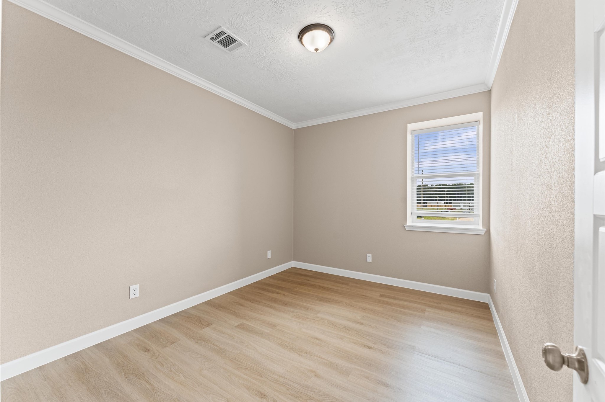 1207 Peter Pne Street Huffman, TX 77336 - Photo 22 of 30 a view of an empty room with wooden floor and a window