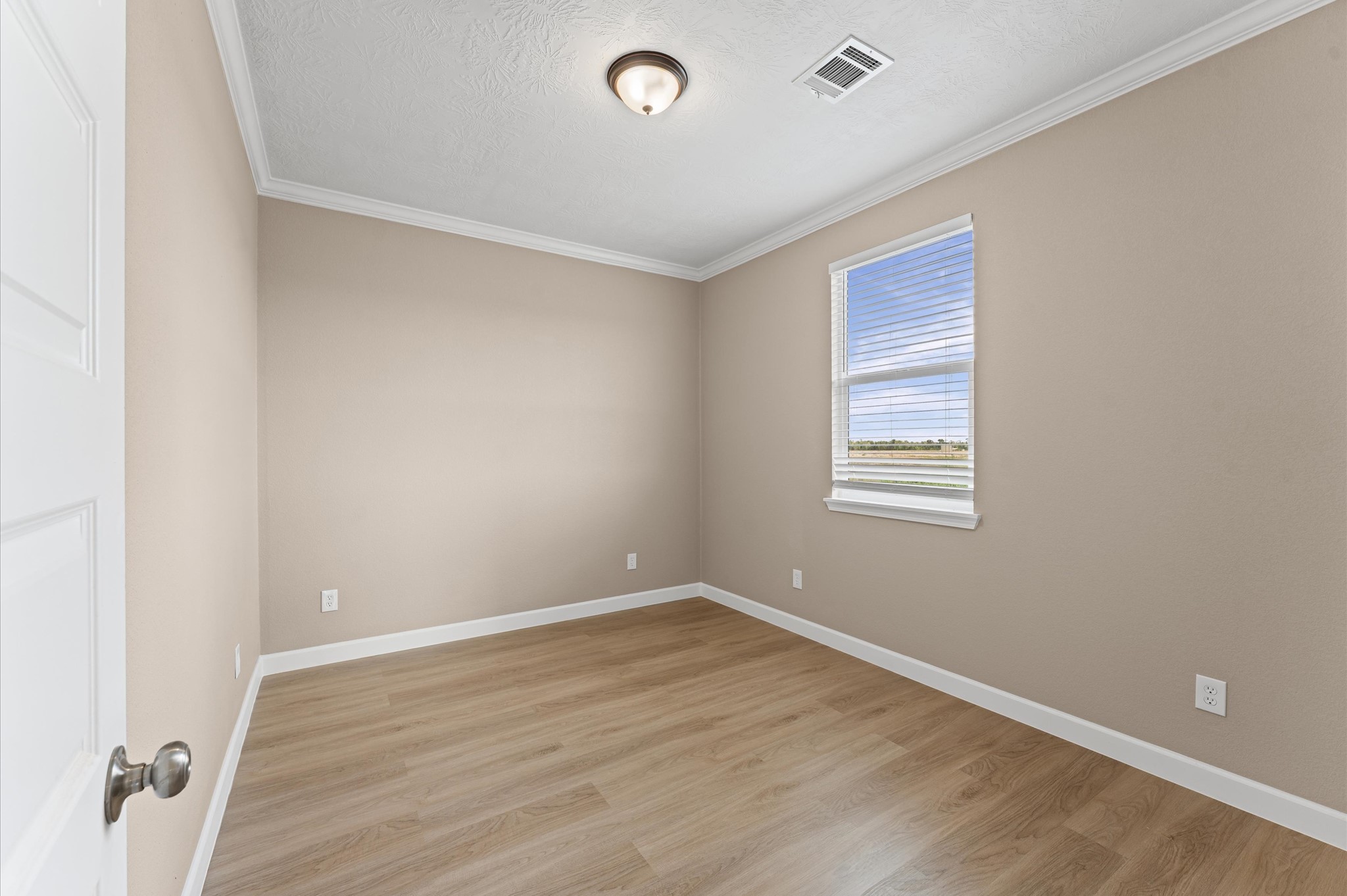 1207 Peter Pne Street Huffman, TX 77336 - Photo 23 of 30 a view of a room with wooden floor and window