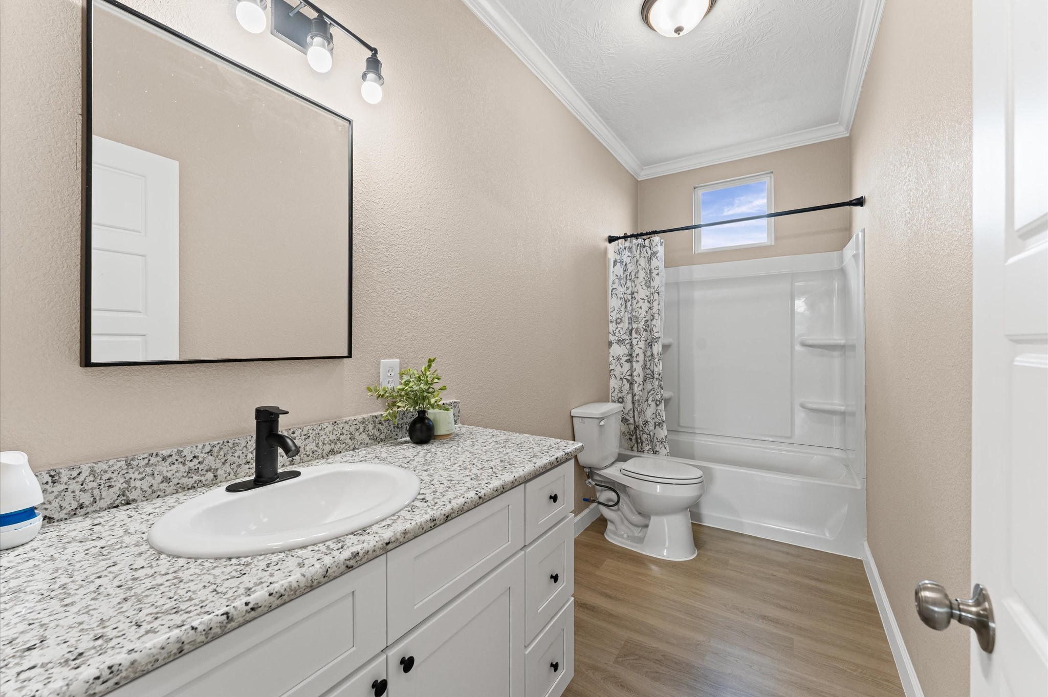 1207 Peter Pne Street Huffman, TX 77336 - Photo 24 of 30 a bathroom with a granite countertop sink a toilet and a mirror