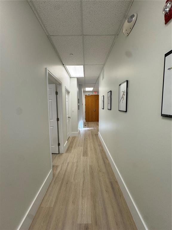 6052 Turkey Lake Road, Unit 118 Orlando, FL 32819 - Photo 4 of 11 a view of a hallway with wooden floor