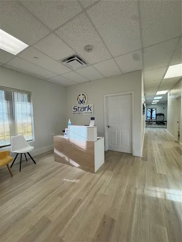 a spacious bedroom with a bed and a table