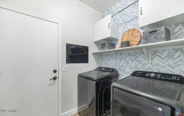 a utility room with dryer and washer