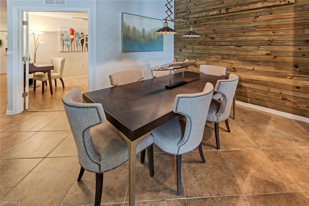 9513 Avellino Way, Unit 2024 Naples, FL 34113 - Photo 12 of 33 a view of a dining room with furniture