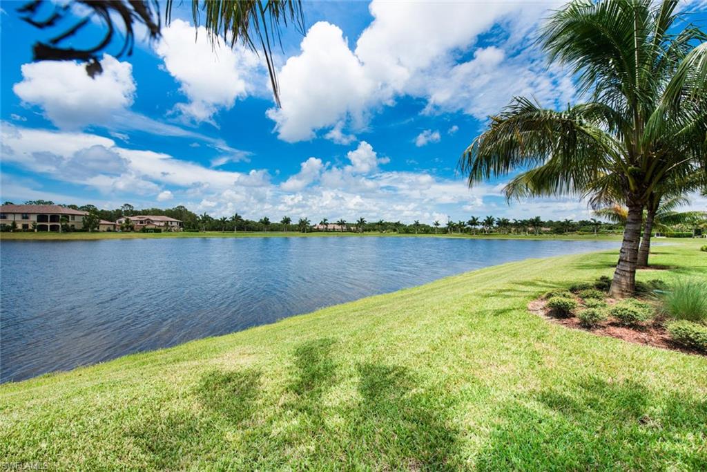 9513 Avellino Way, Unit 2024 Naples, FL 34113 - Photo 22 of 33 a view of a lake with houses in the back