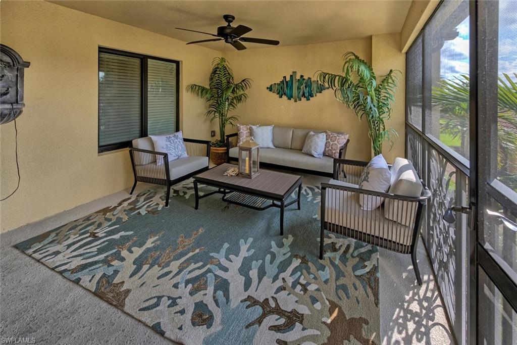 9513 Avellino Way, Unit 2024 Naples, FL 34113 - Photo 6 of 33 view of a livingroom with furniture and window