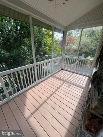 a balcony with wooden floor