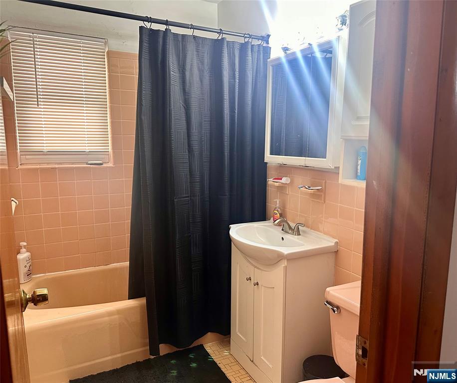 237 Riverview Place, Unit 2 Cliffside Park, NJ 07010 - Photo 11 of 11 a bathroom with a sink a toilet and shower