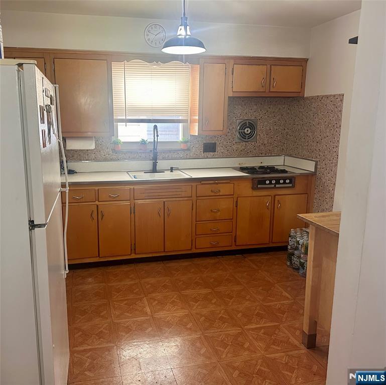 237 Riverview Place, Unit 2 Cliffside Park, NJ 07010 - Photo 5 of 11 a kitchen with stainless steel appliances granite countertop a sink stove and refrigerator
