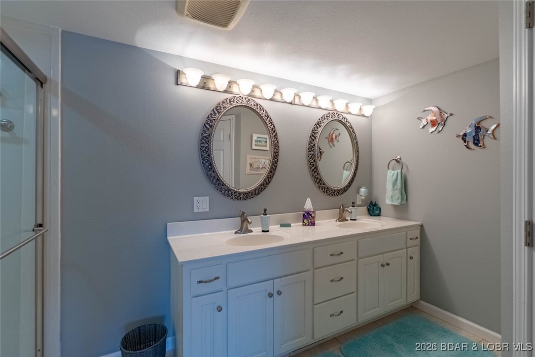 52 Cedar Road, Unit 2A Lake Ozark, MO 65049 - Photo 24 of 48 Updated Master Bathrm w/Private Stool area & walk-