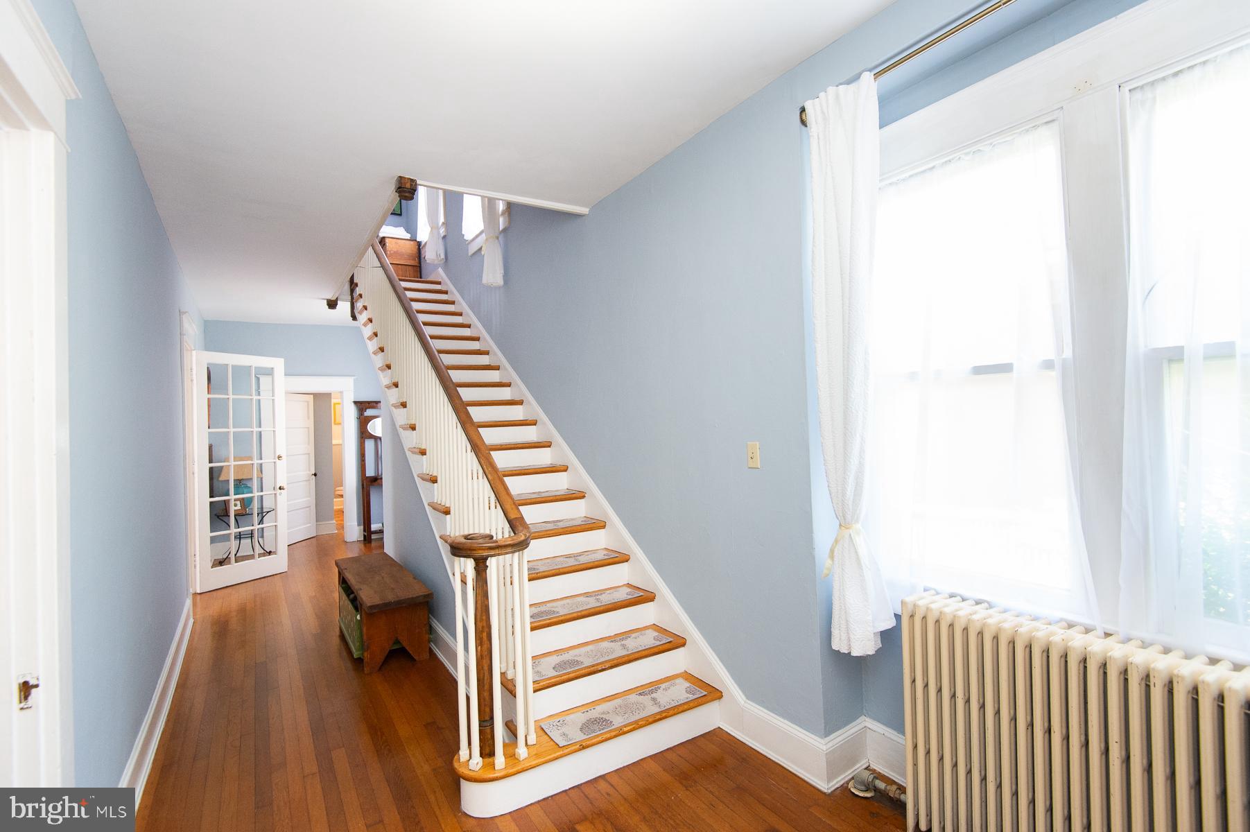 606 Locust Street Cambridge, MD 21613 - Photo 6 of 37 a view of a hallway with windows and wooden floor