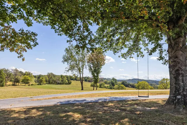 a bathroom with a granite countertop sink and a vanity