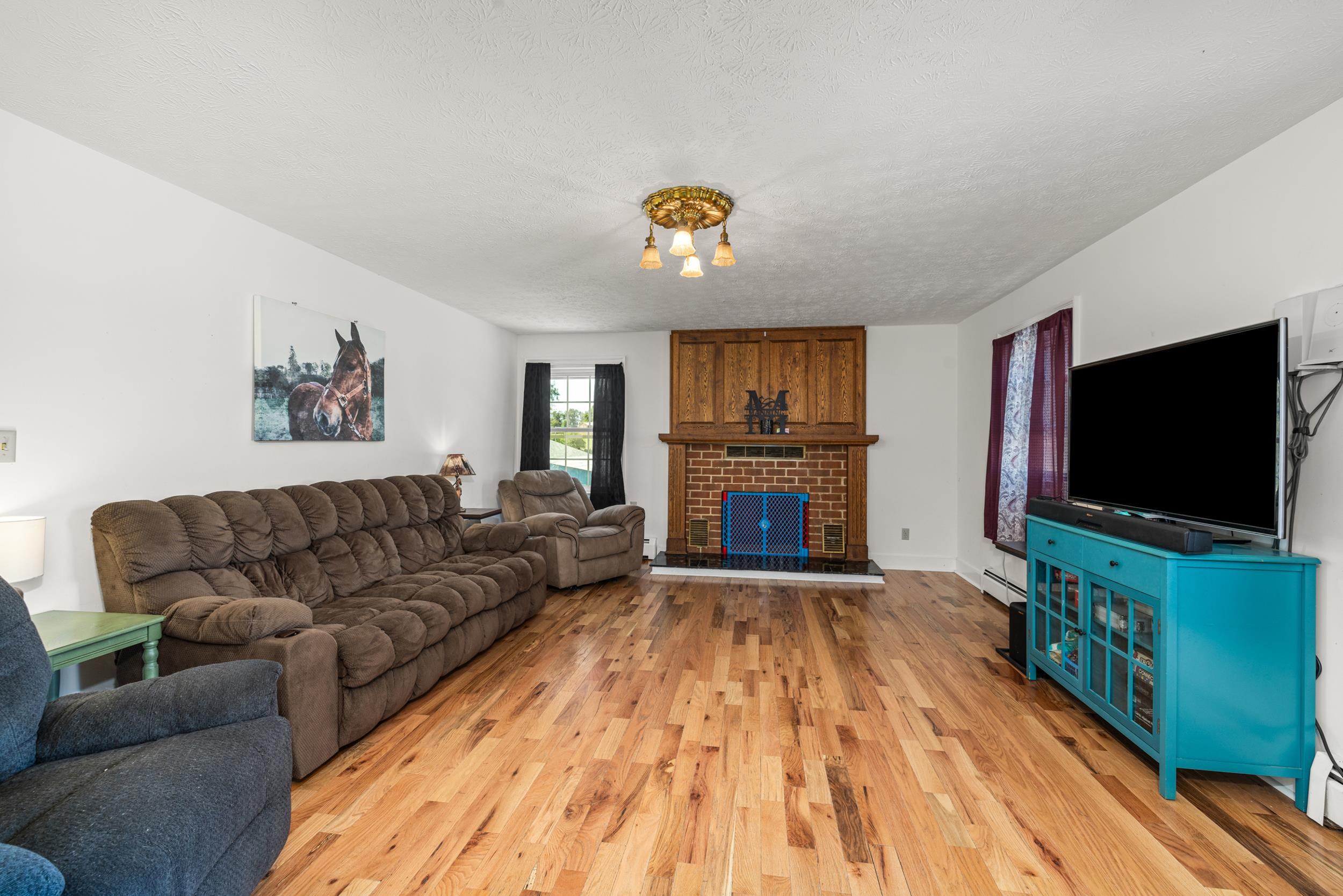 1370 Middlebrook Road Staunton, VA 24401 - Photo 23 of 73 a living room with furniture and a flat screen tv