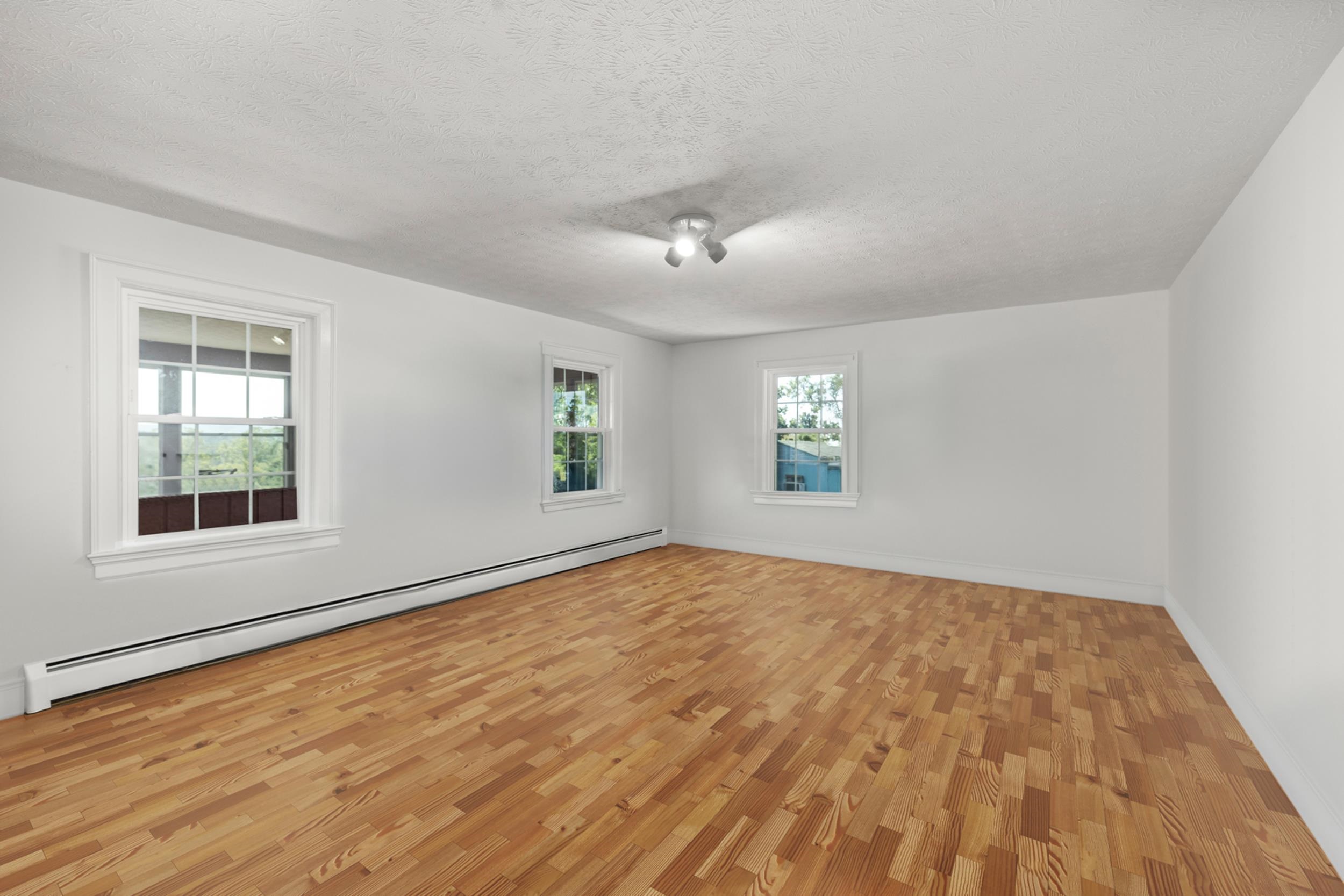 1370 Middlebrook Road Staunton, VA 24401 - Photo 32 of 73 a view of an empty room with a window and wooden floor