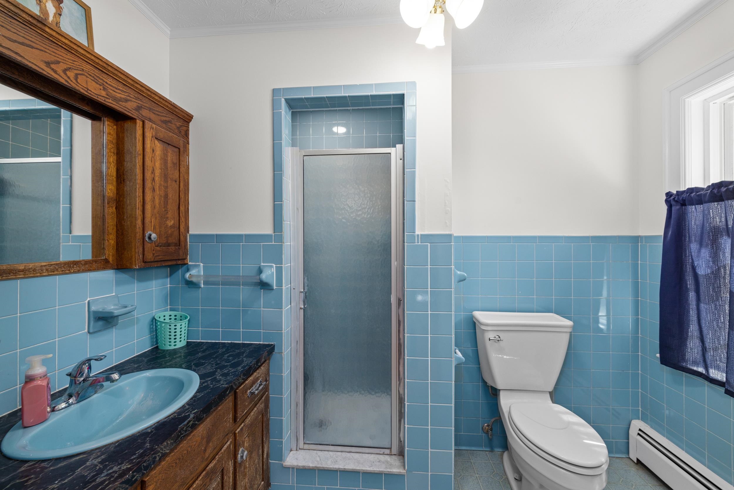 1370 Middlebrook Road Staunton, VA 24401 - Photo 39 of 73 a bathroom with a granite countertop toilet sink and mirror