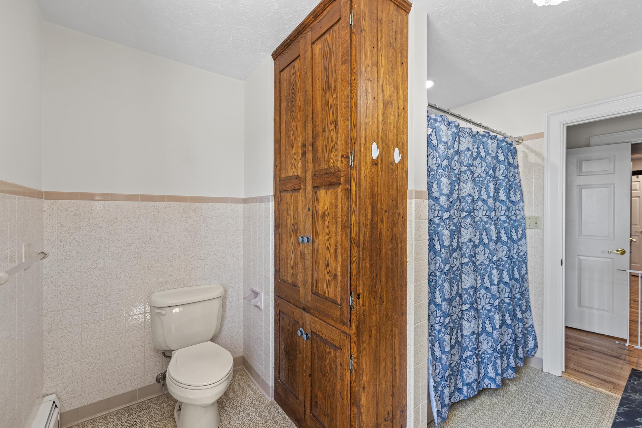 1370 Middlebrook Road Staunton, VA 24401 - Photo 48 of 73 a white toilet sitting next to a shower curtain