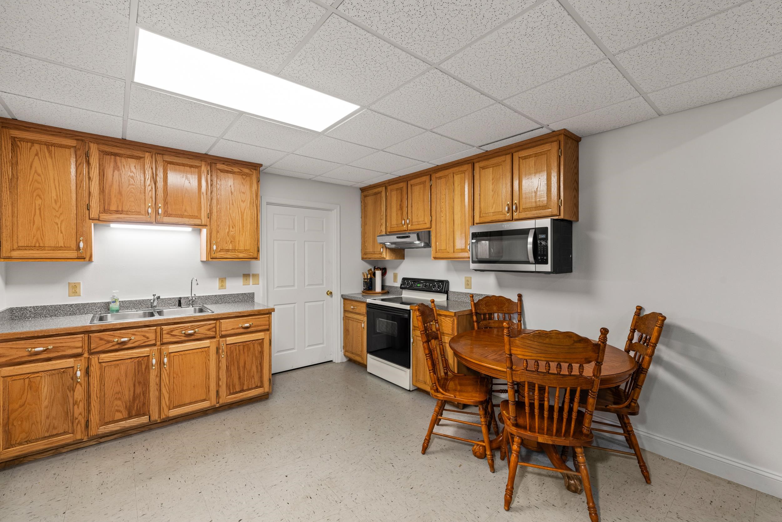 1370 Middlebrook Road Staunton, VA 24401 - Photo 54 of 73 a kitchen with stainless steel appliances granite countertop wooden cabinets a stove top oven a sink and dishwasher