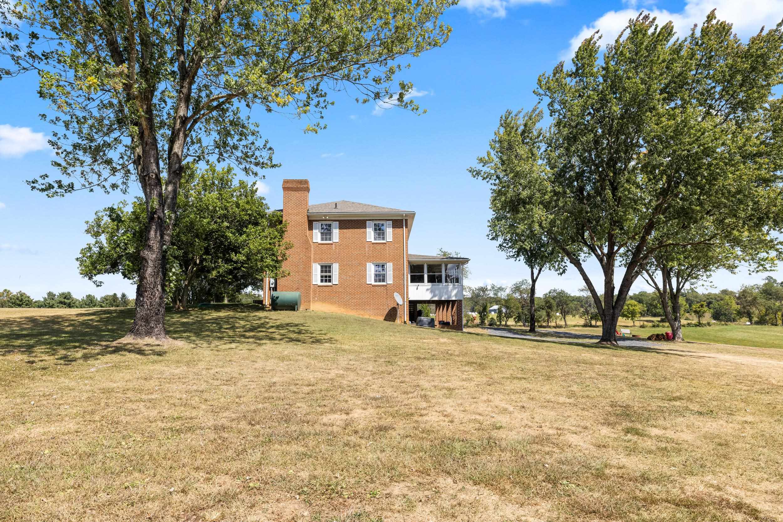 1370 Middlebrook Road Staunton, VA 24401 - Photo 7 of 73 a view of a yard with a tree