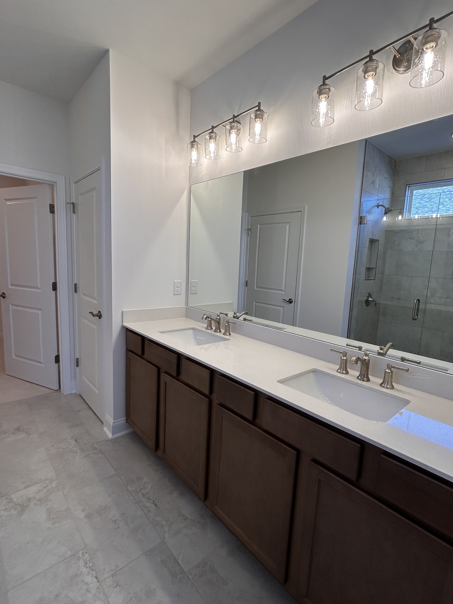 420 Sharp Way Murfreesboro, TN 37128 - Photo 15 of 51 a bathroom with double vanity sinks and a mirror
