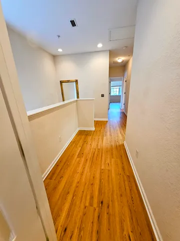 a view of wooden floor in a bathroom
