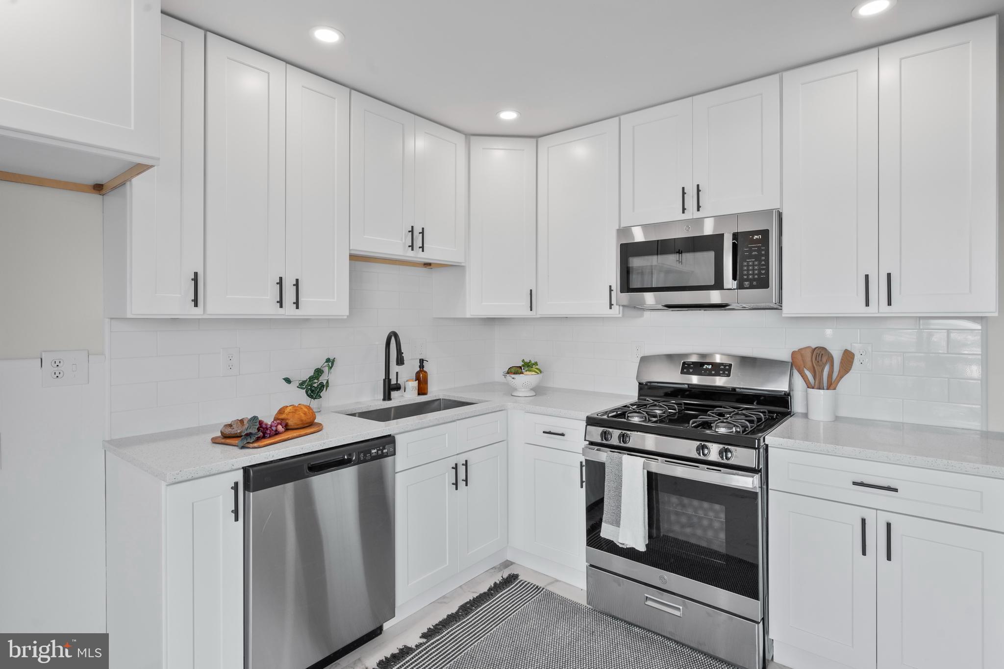 3901 Gibbons Road Point of Rocks, MD 21777 - Photo 8 of 44 a kitchen with stainless steel appliances a stove a sink and cabinets