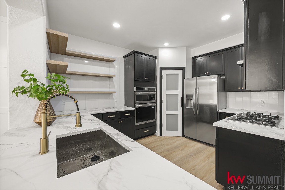 a kitchen with a refrigerator and a sink