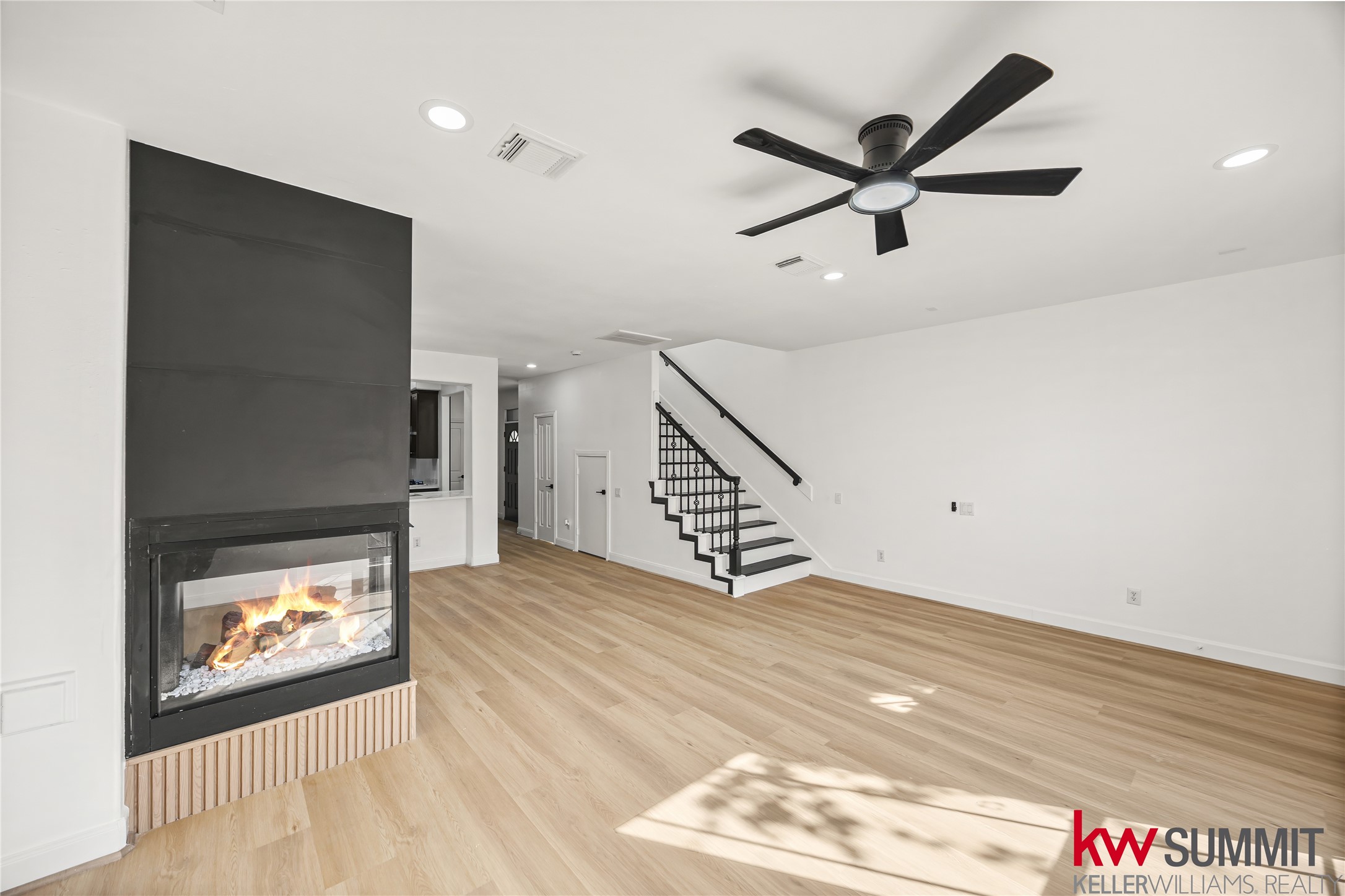 2410 Calumet Street, Unit B Houston, TX 77004 - Photo 18 of 34 a view of an empty room with wooden floor and a ceiling fan