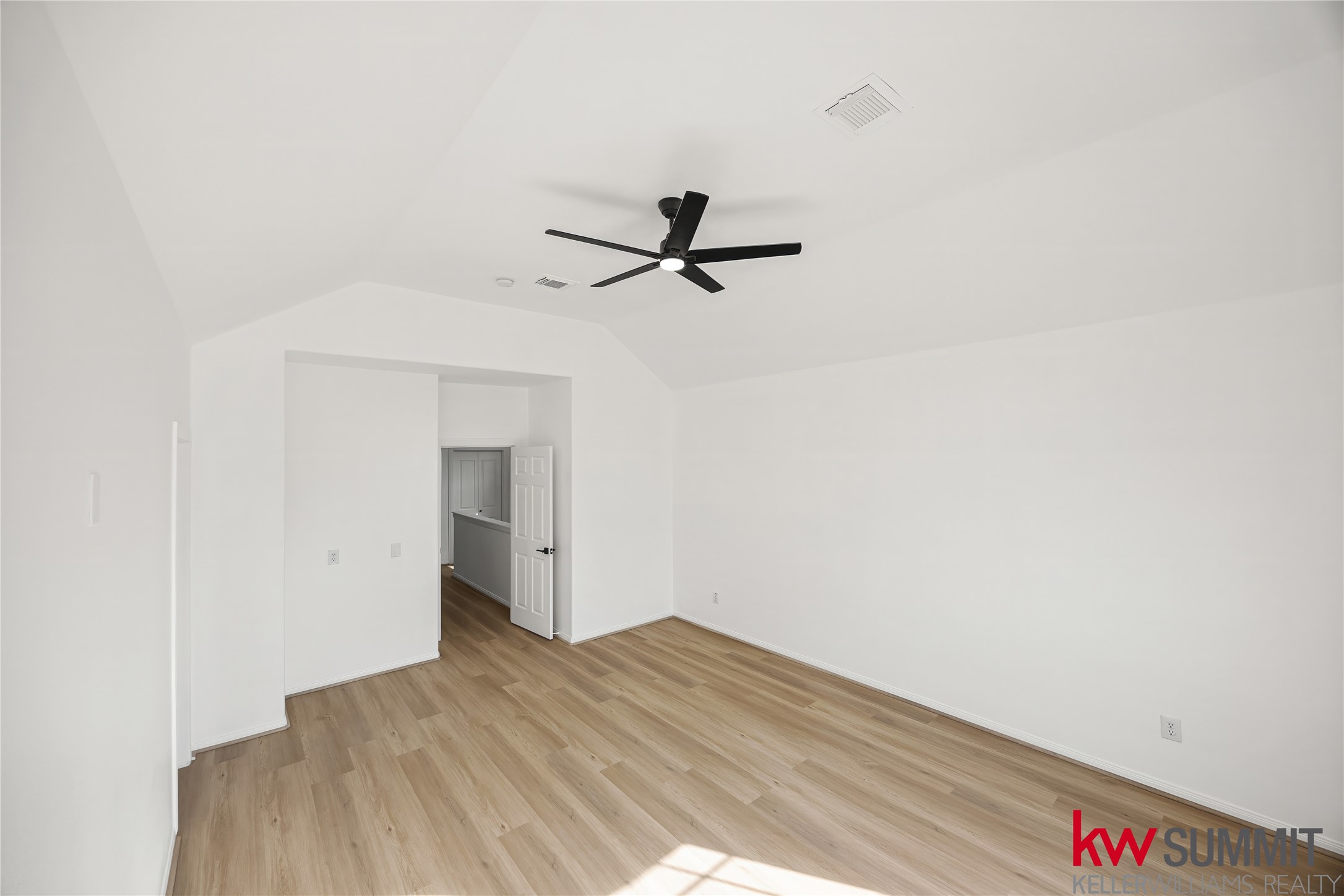 2410 Calumet Street, Unit B Houston, TX 77004 - Photo 22 of 34 a view of a room with wooden floor and a ceiling fan