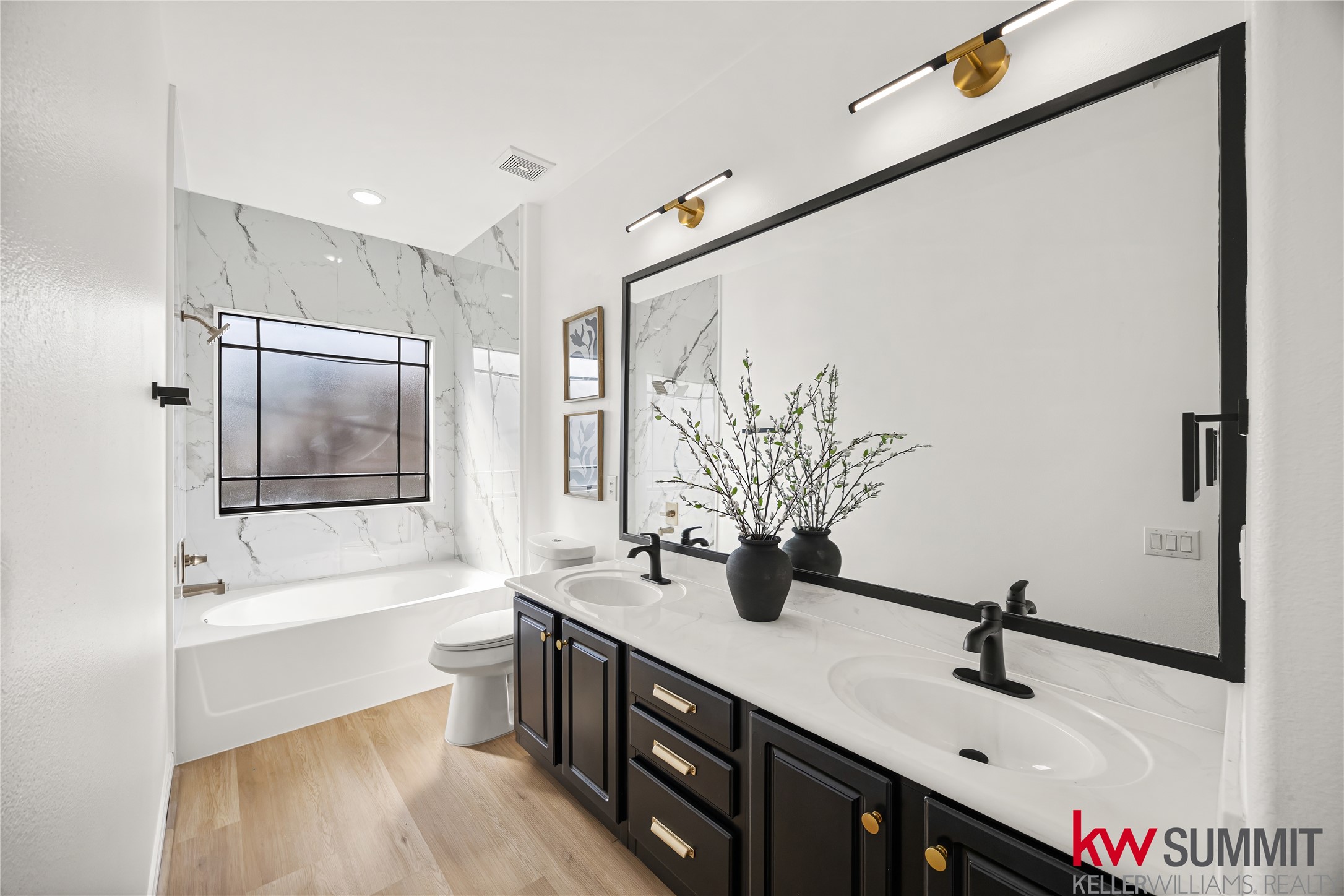 2410 Calumet Street, Unit B Houston, TX 77004 - Photo 23 of 34 a bathroom with a double vanity sink a mirror and a bathtub