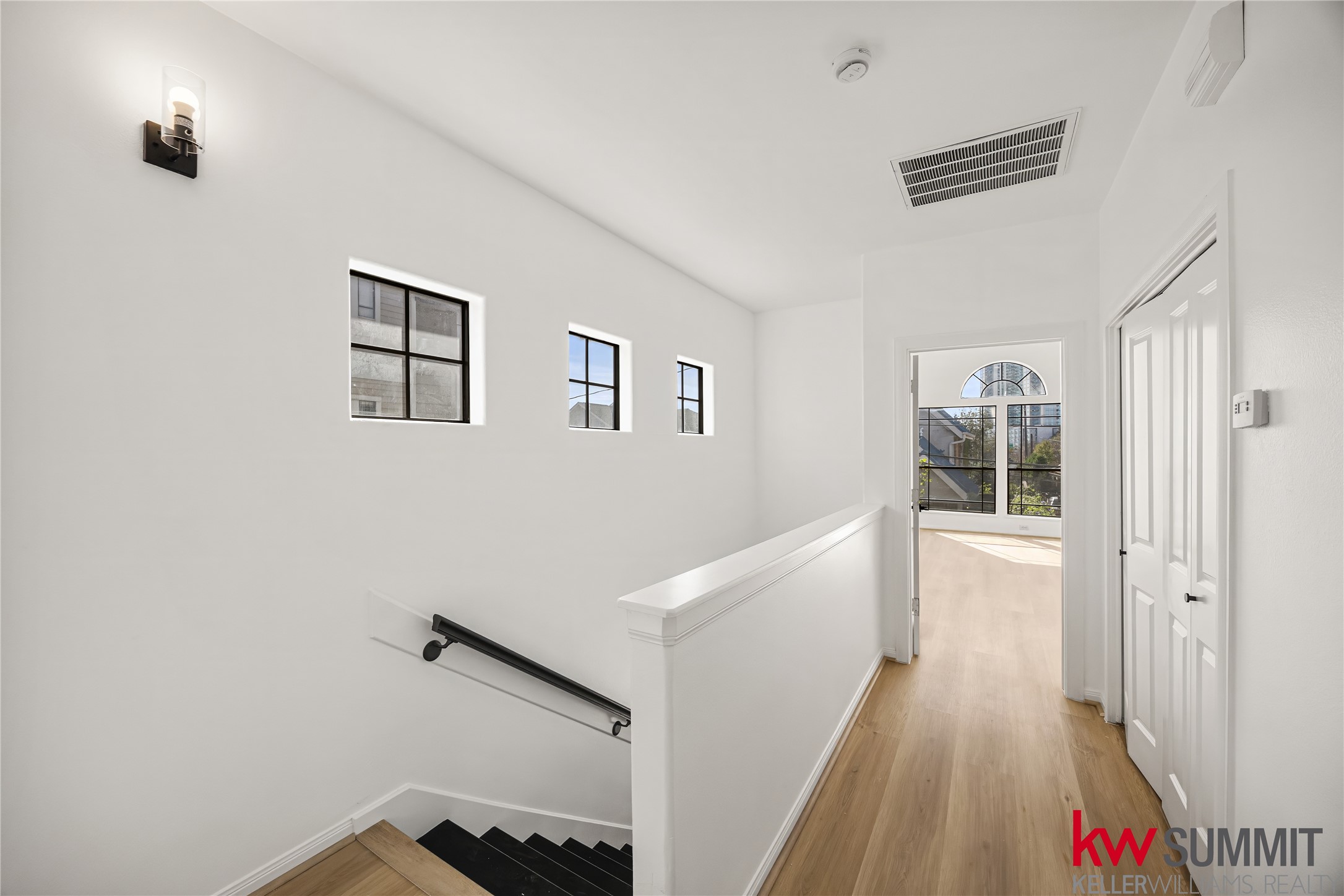 2410 Calumet Street, Unit B Houston, TX 77004 - Photo 27 of 34 a view of hallway with stairs and wooden floor