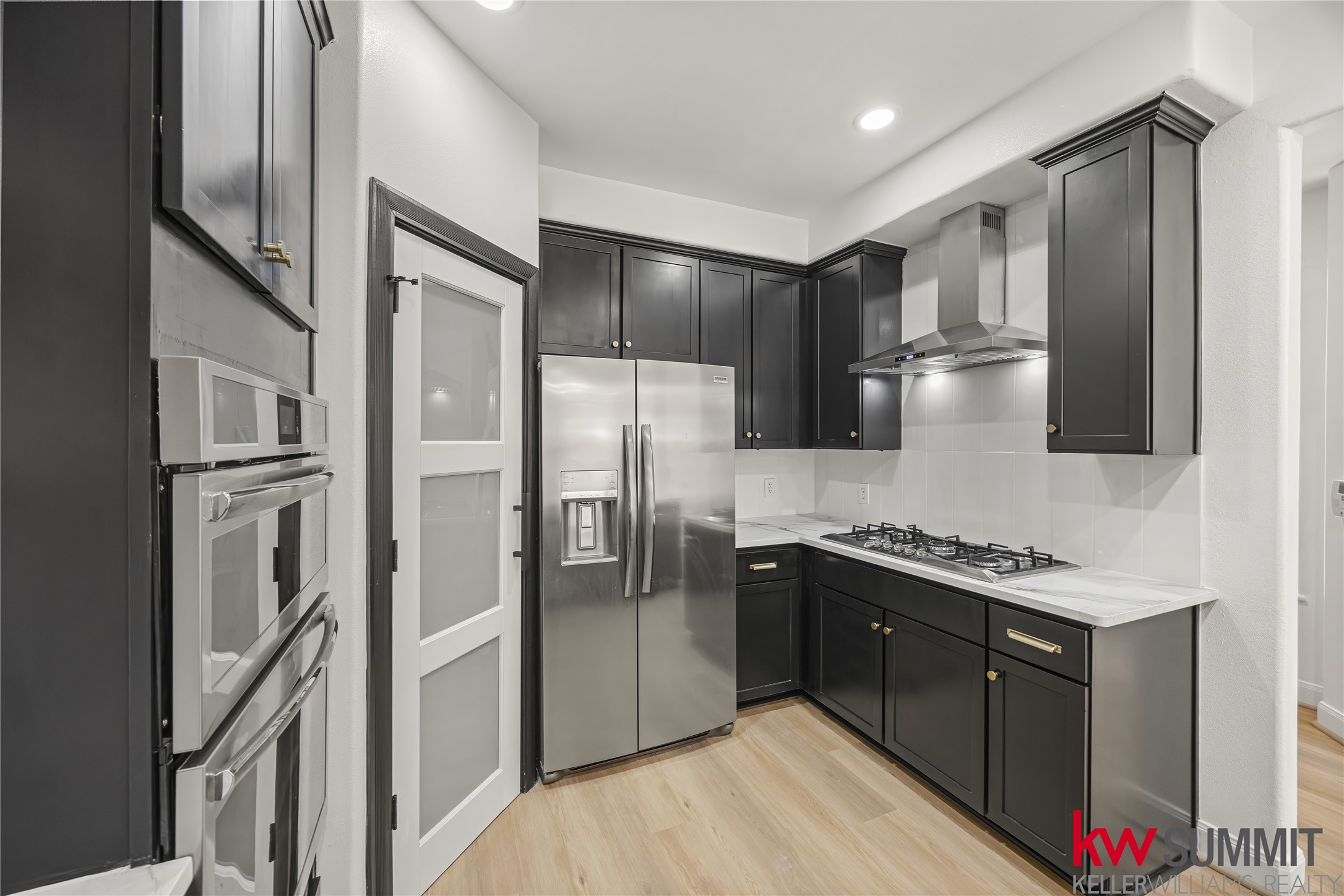 2410 Calumet Street, Unit B Houston, TX 77004 - Photo 8 of 34 a kitchen with stainless steel appliances granite countertop a refrigerator and a sink