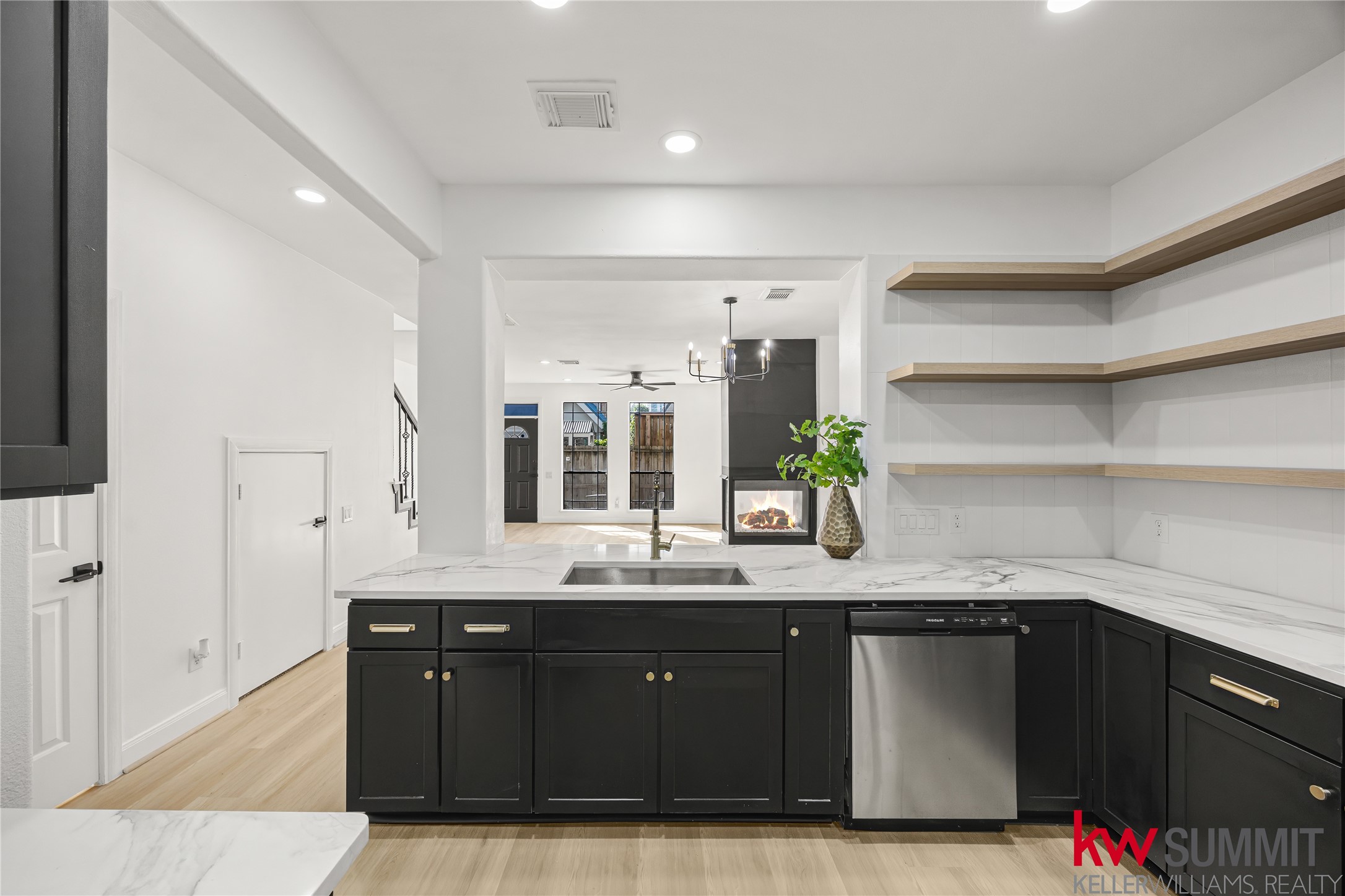 2410 Calumet Street, Unit B Houston, TX 77004 - Photo 9 of 34 a bathroom with a granite countertop sink a large mirror and a